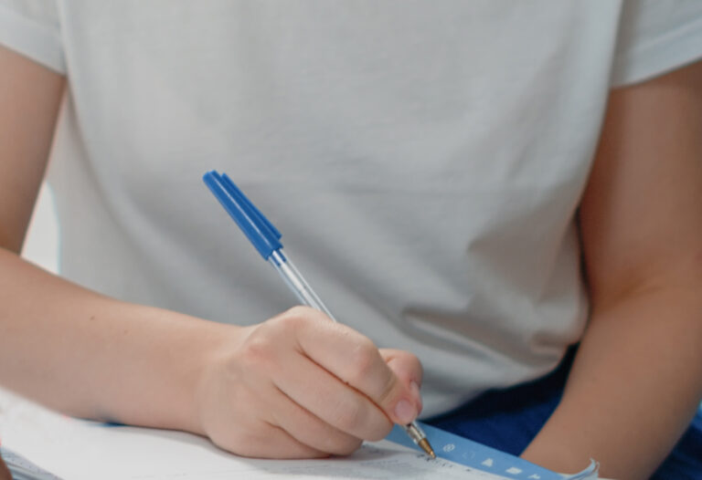 Close up of woman signing checkup documents for treatment from specialist. Medic asking for signature on prescription papers from sick patient at medical visit. Person and doctor with files