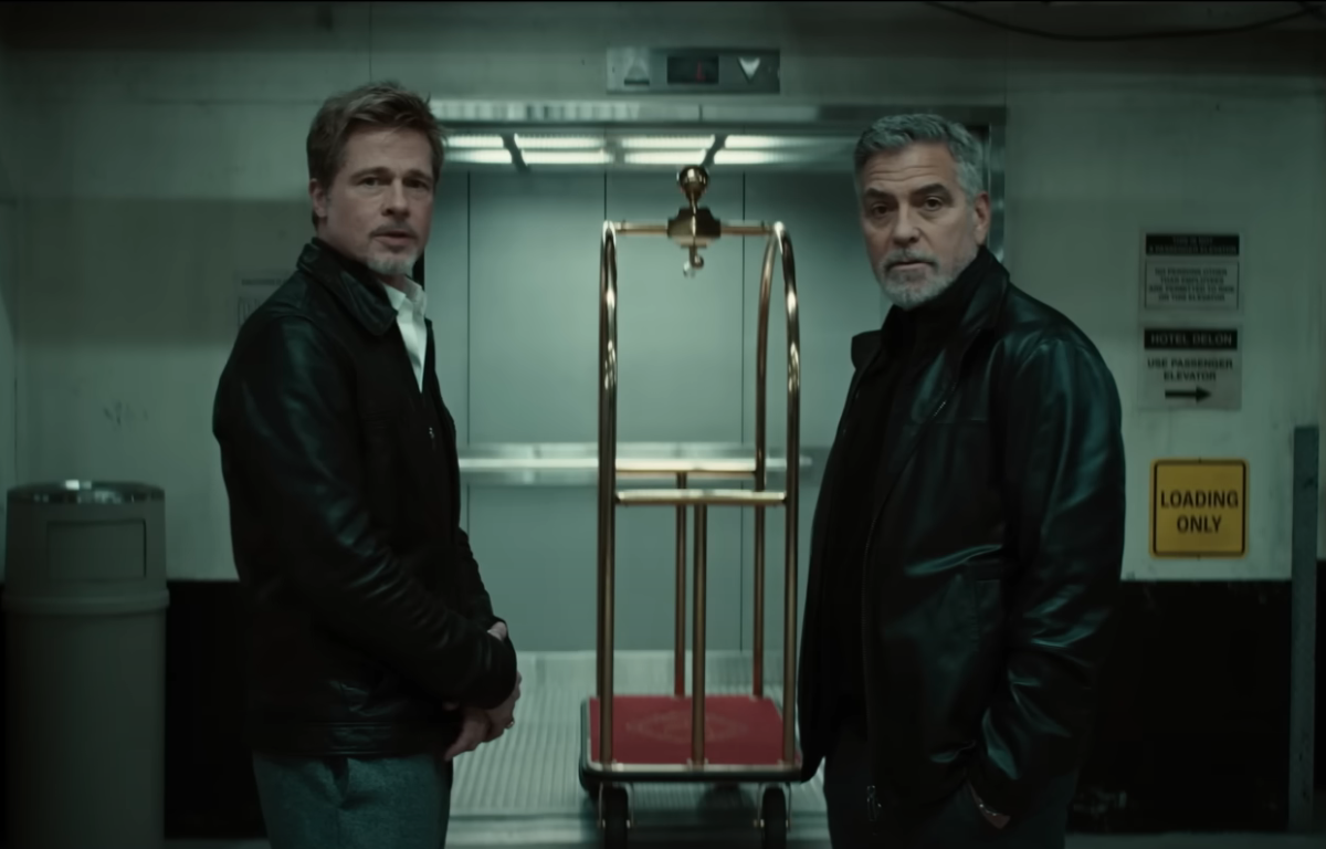 George Clooney e Brad Pitt em cena de Lobos, filme recorde da Apple TV+, que conquistou 96 países em uma semana de estreia.