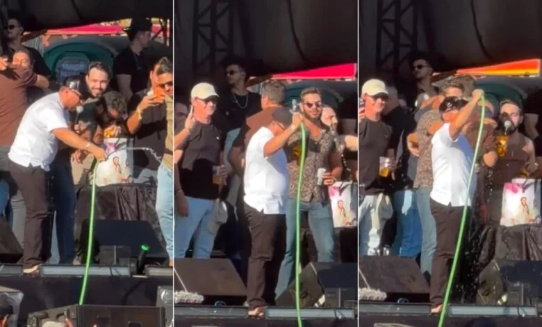 Nem o palco escapou do calor: Henrique e Xand Avião tomam banho de mangueira durante show em Palmas; VÍDEO